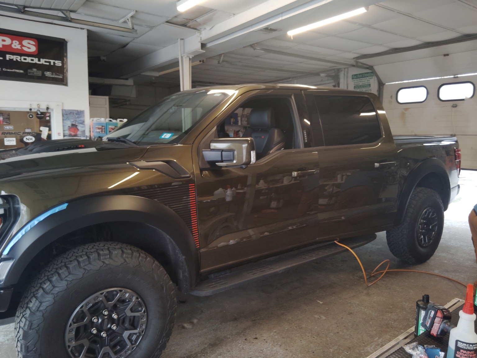Brown Ford Raptor truck detailed in the Rye Boat & Auto Detailing shop