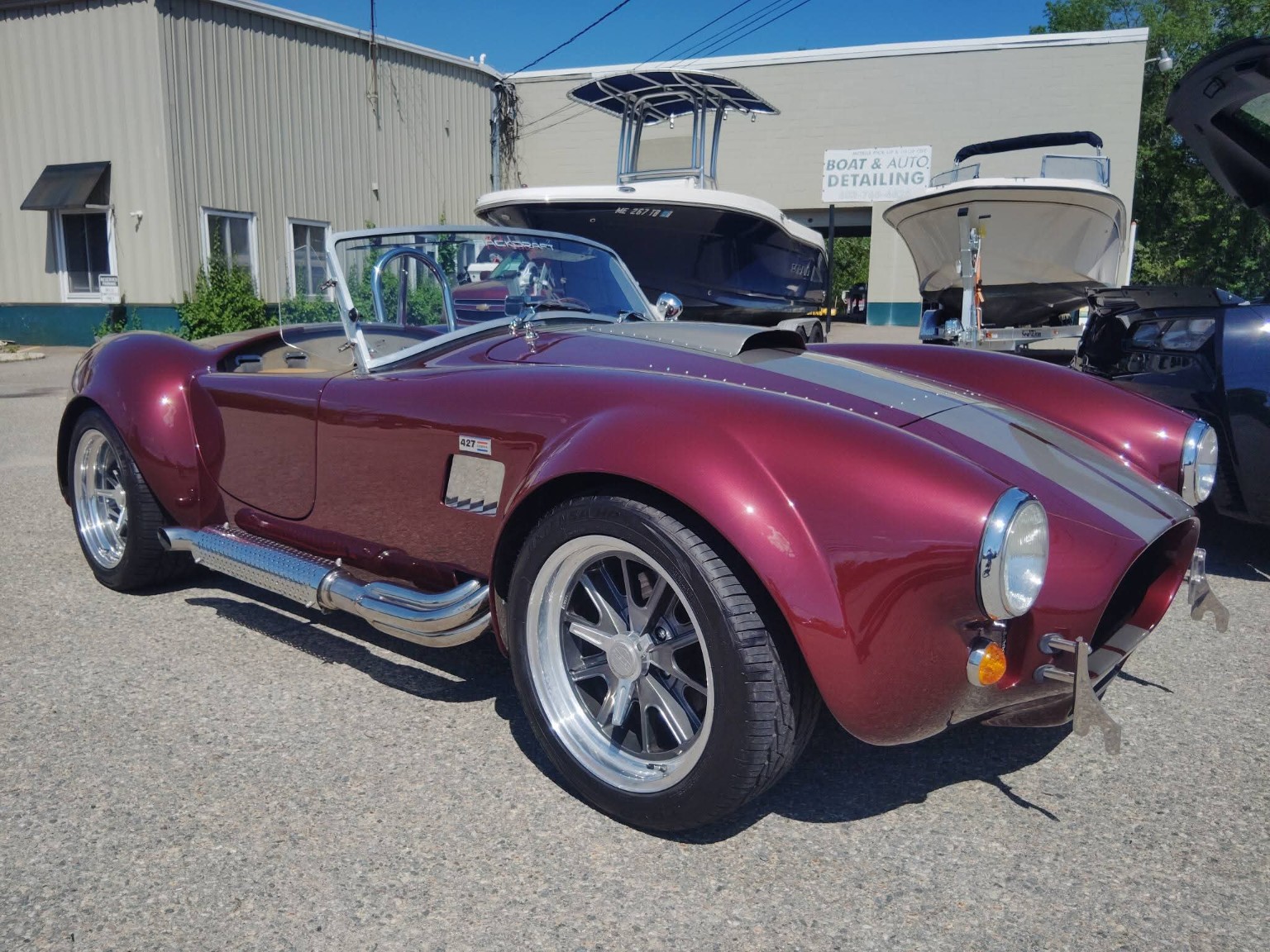 Burgundy roadster full side profile — classic vehicle detailing
